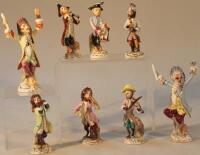A quantity of Continental porcelain monkey band figures