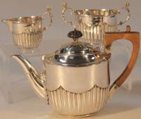 A Victorian silver three piece bachelor's tea service