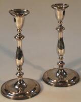 A pair of silver plated candlesticks