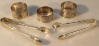 Three similar silver napkin rings