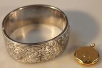 A hinged bangle with engraved decoration