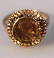 A 9ct gentleman's ring centred with a miniature coin