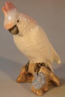 A Royal Dux figure of a parakeet