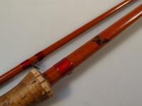 An early 20thC Hardy two-piece split cane fishing rod