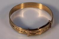 A 9ct gold bangle