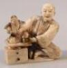 A Meiji Japanese carved ivory figure group