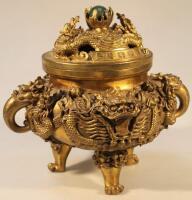 A heavily cast Chinese gilt metal censer and cover