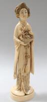 A Japanese carved ivory okimono figure