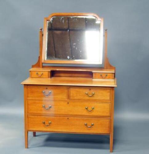 An Edwardian mahogany bedroom suite