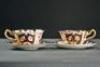 A pair of Royal Crown Derby coffee cups and saucers