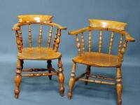 A pair of early 20thC oak smokers bow chairs