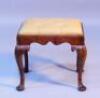 A Victorian upholstered stool