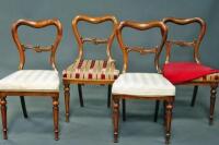 A set of four Victorian walnut balloonback dining chairs