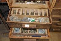 Two drawers of brass screws