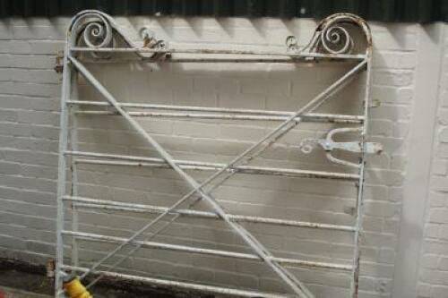 A pair of painted wrought iron gates