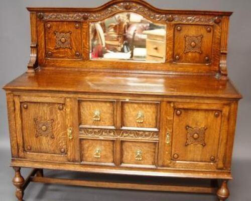 An early 20thC Jacobean Revival mirrorback sideboard