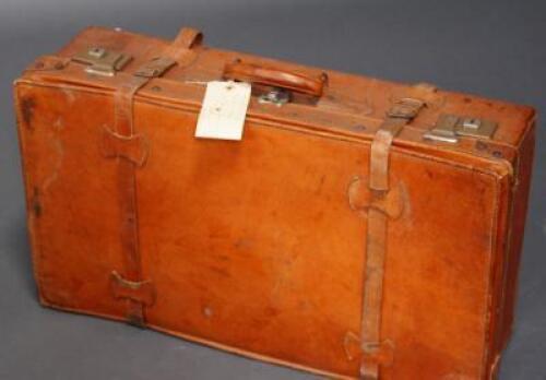 A mid 20thC leather suitcase.