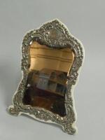 An Edwardian silver mounted cottage shaped dressing mirror