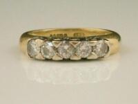 An 18ct gold five stone diamond ring