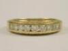 An 18ct gold diamond channel set ring