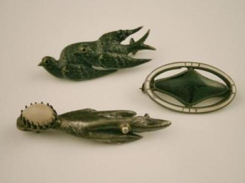 Three brooches