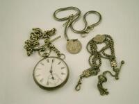 A silver pocket watch and various chains