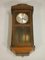 A 20thC mahogany wall clock