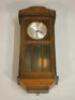 A 20thC mahogany wall clock