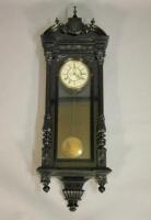 A late 19thC ebonised Vienna style wall clock