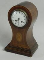 An Edwardian mahogany balloon shaped mantel clock