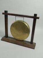 A bronzed table gong