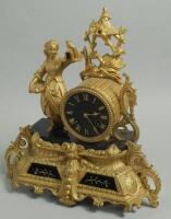 A French gilt metal and black marble figural mantel clock