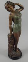 An Art Deco bronzed plaster figure of a bather