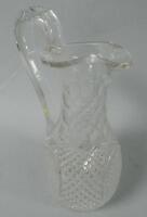 A cut glass carafe or water jug