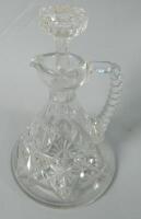 A cut glass ship's claret jug and stopper