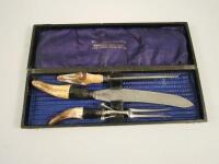 An unusual horn mounted and steel carving set