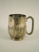 A George V silver part fluted christening mug