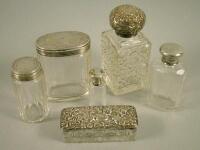 Various cut glass and other silver topped jars
