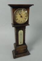 A 1920's miniature oak longcase clock with thermometer