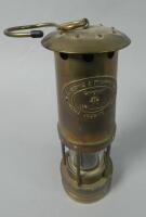 A brass miner's lamp