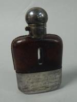 A silver plated and leather hip flask