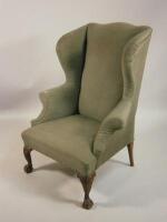 A wingback armchair in George III style