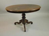 A Victorian walnut oval breakfast table