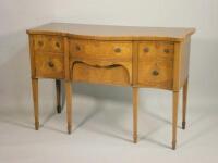 A mahogany serpentine fronted sideboard