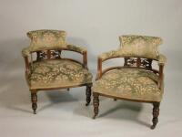 A pair of late Victorian mahogany tub shaped chairs