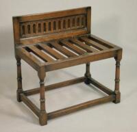 An early 20thC oak luggage rack