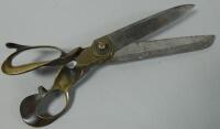 A large pair of dress making or cloth scissors