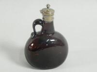 A Victorian brown tinted glass whisky jug