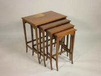 A nest of four Edwardian mahogany and chequer banded tables