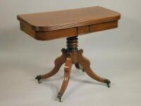 An early 19thC mahogany tea table